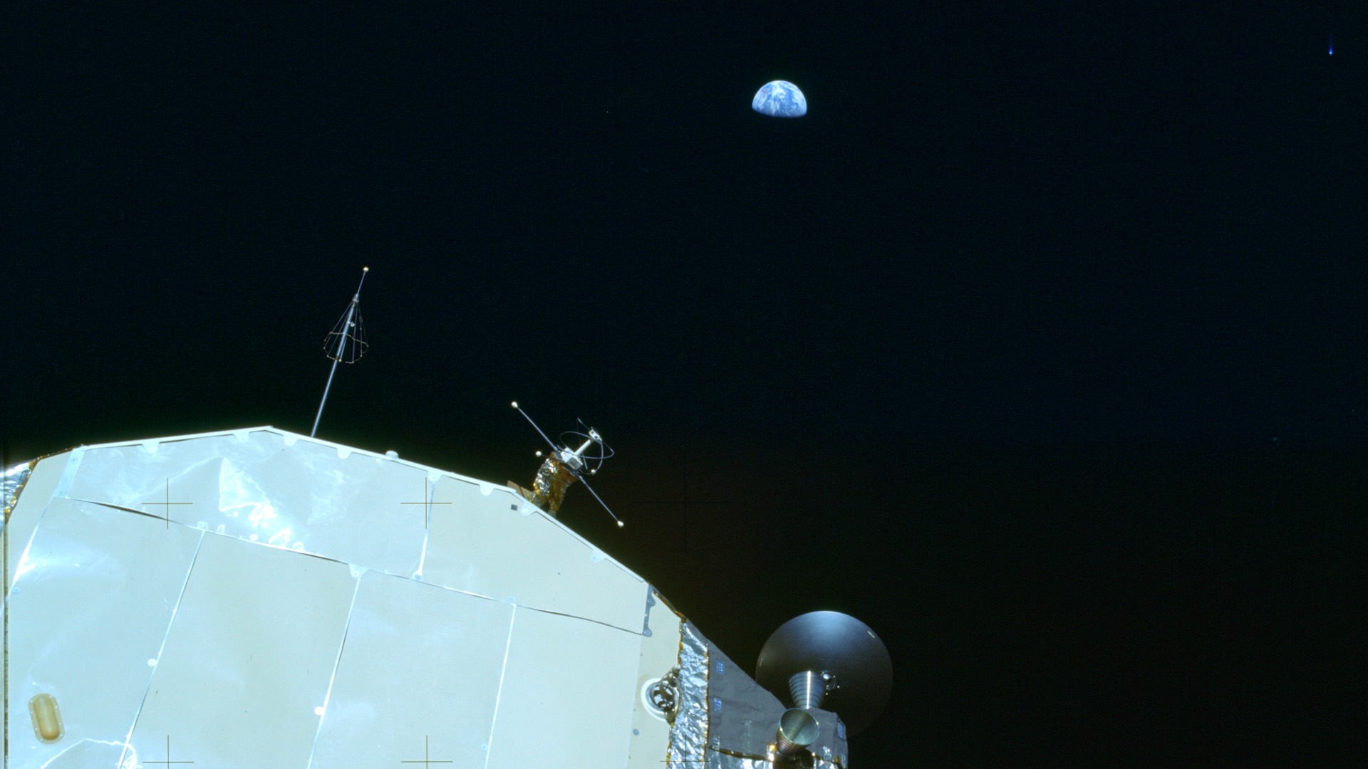 The Apollo 11 lunar module Eagle and Earth against the black sky, photographed by Neil Armstrong from the Moon's surface